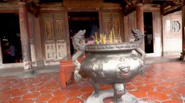 CHANGHUA, TAIWAN - MARCH 26, 2018:Closeup scene of the traditional incense burner in front of the temple. Translation of the word curved on the incence burner texted'' Longshan Temple''.