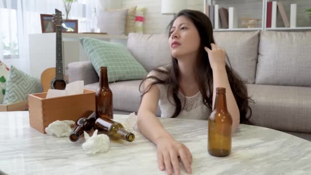 Asian Woman Low Spirit Sitting Floor Beer Bottles Used Tissue — Stock Video