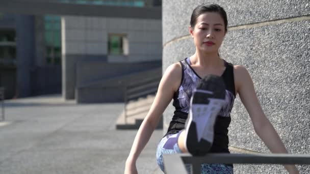 Slow Motion Female Asian Runner Stretching Her Legs Outdoor Running — Vídeo de Stock