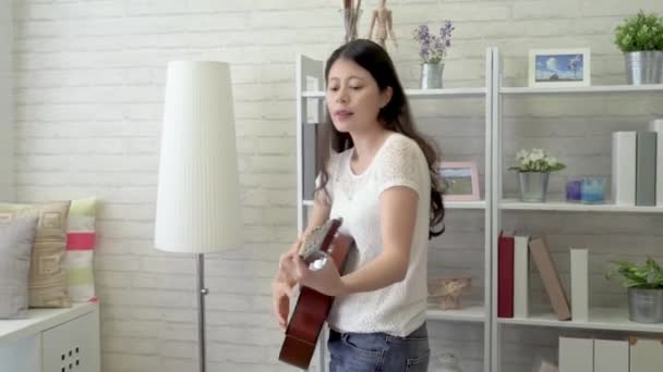 Asian Woman Holding Guitar Playing Singing Her Favourite Love Pop — Stock Video