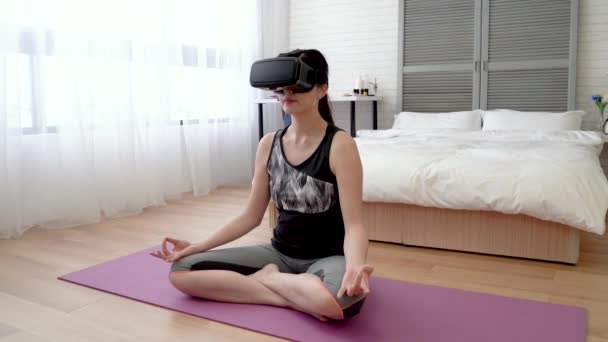 Asain Woman Wearing Headset Sitting Yoga Mat She Puts Her — Stock Video