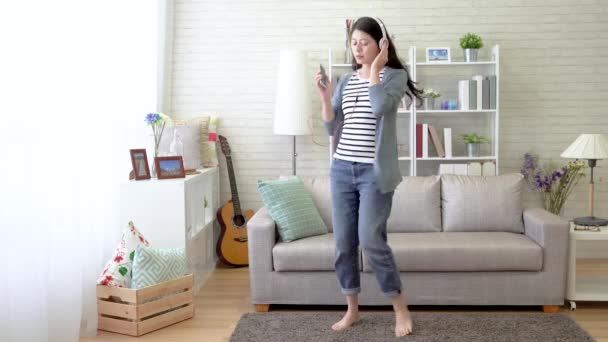 Asian Young Lady Listening Music Living Room Danced Left Right — Stock Video