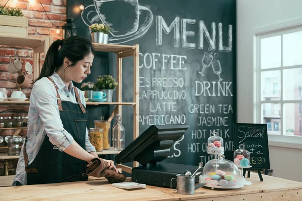 Cafe owner lady using cloth to wipe — Stock Photo, Image