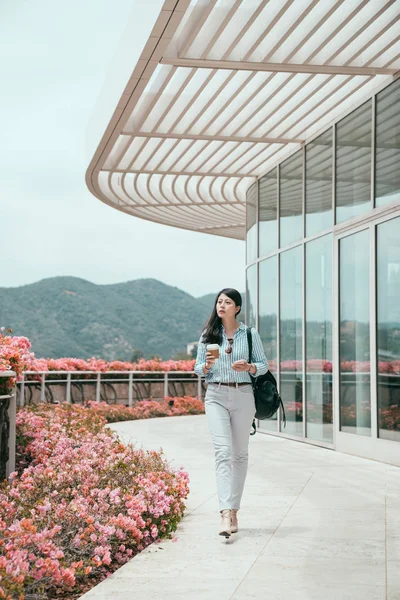 Businesswoman holding in hand paper cup of coffee Royalty Free Stock Images