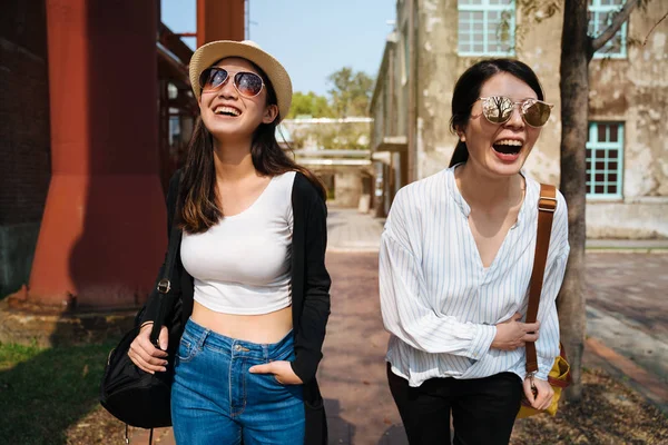 Happy friends laughing in old city street Royalty Free Stock Images