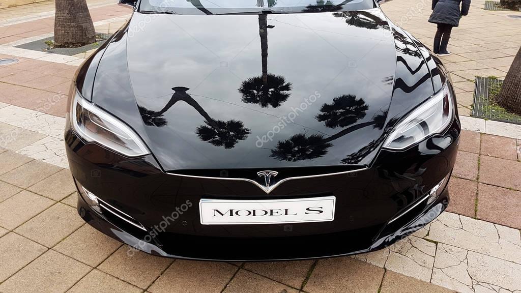 Menton, France - March 3, 2018: Black Tesla Model S (Front View) Electric Car Parked on a Square in Menton on The French Riviera. The Tesla Model S is a Luxury Full-Sized Electric Five Door