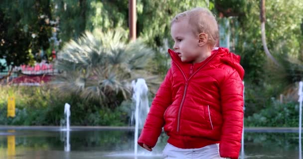 Portrait Cute Sulking Blond Baby Boy Red Jacket Two Years — стокове відео