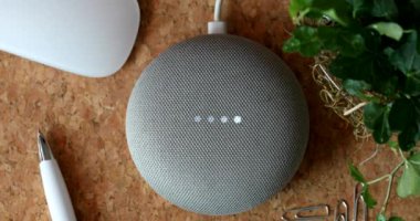 Nice, France - February 13 2020: Google Home Mini On The Cork Desk. Smart Speaker With The Google Assistant, Virtual Assistant Powered By Artificial Intelligence. Close Up View - DCi 4K Resolution