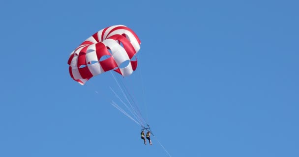 Two Young Women Parasailing Blue Sky Sunny Beach Bulgaria Black — Stock Video