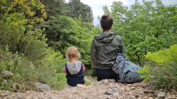 Rear View Little Boy His Mom Sitting Mountain Path Nature — Stock Video