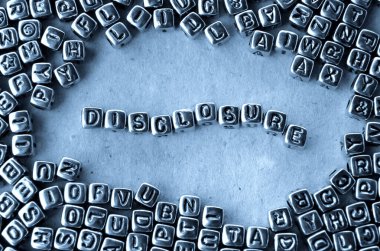 Disclosure - Word from Metal Blocks on Paper - Concept Photo on Table clipart
