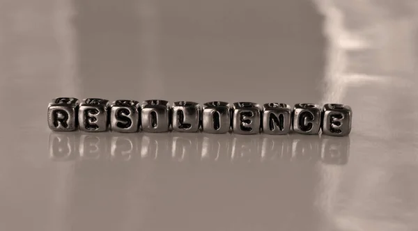 Resilience Word Metal Blocks Concept Sepia Tone Photo Shine Background — Stock Photo, Image