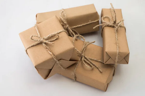 Stack of handcraft gift boxes on white background — Stock Photo, Image