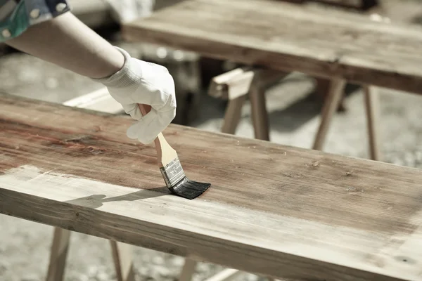 Painting wood with wood protection paint — Stock Photo, Image