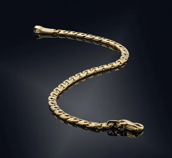 Golden bracelet isolated on black — Stock Photo, Image