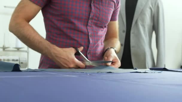 A tailor in a sewing workshop at work. — Stock Video