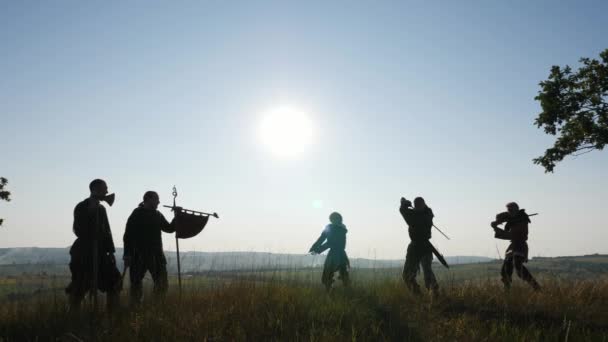 Silhouette of a Vikings practicing using the sword for battle. — Stock Video