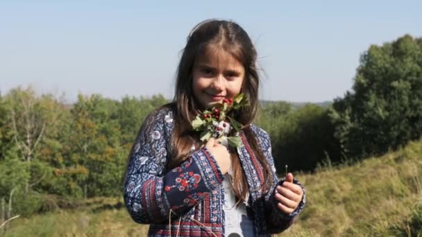 Portrait of happy smilling girl with branch of viburnum — Stock Video