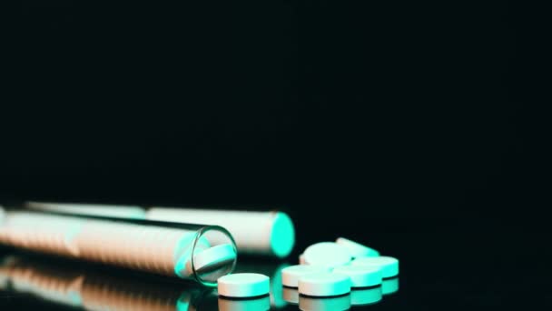 Generic drugs on table top, camera moves slowly accross spilled pills and into the bottle. — Stock Video