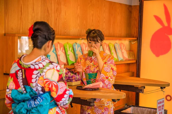 Kimono women drining Amazake — Stock Photo, Image