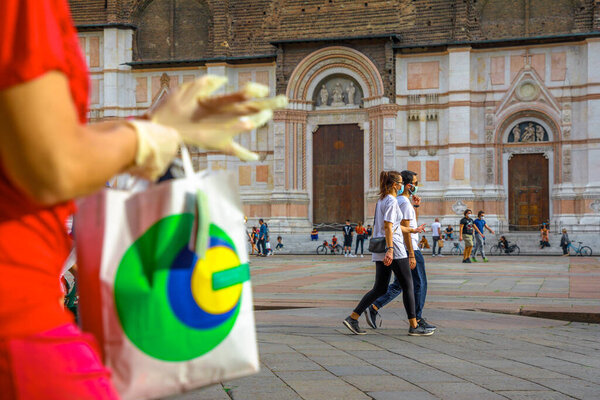 gloves and shopping bag for Covid-19 in Bologna