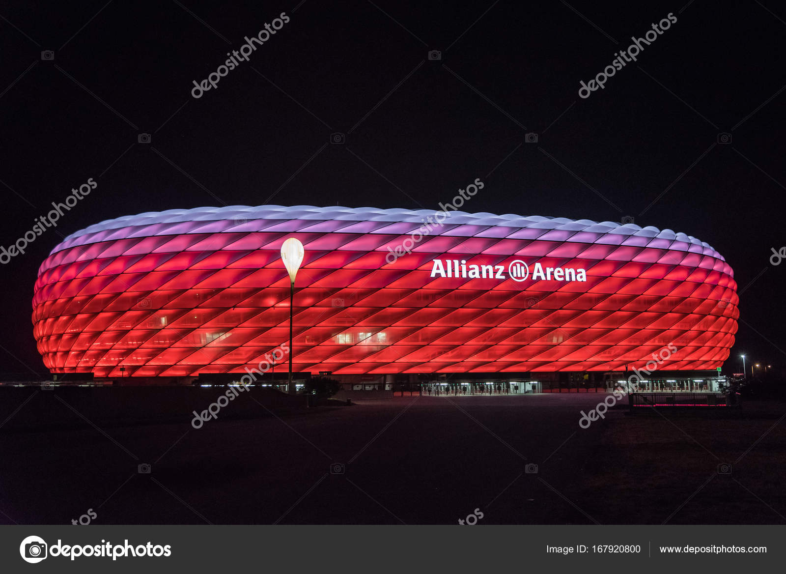 Allianz Arena, the football stadium of FC Bayern, illuminated in red ...