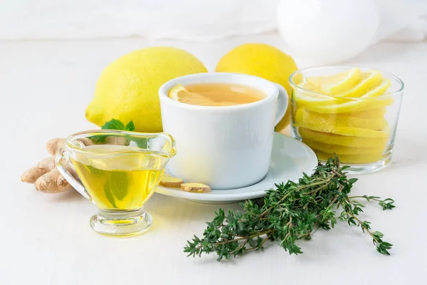 Folk popular ways to treat colds -  cup of tea and a slice of le