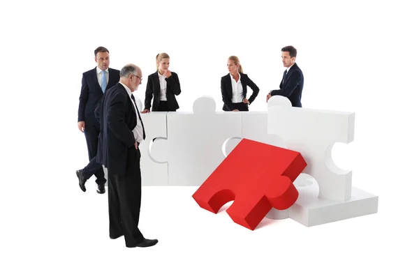 Business people and puzzle — Stock Photo, Image