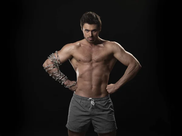 Muscular man with chain on arm — Stock Photo, Image