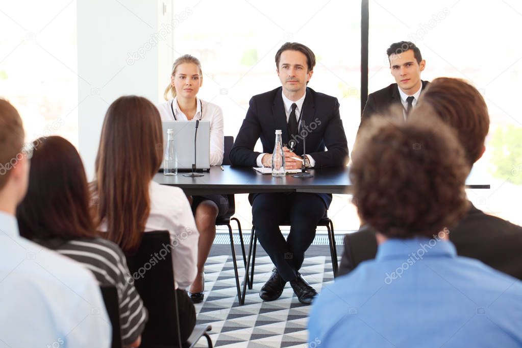 Speakers at business meeting