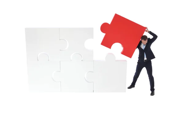 Business pushing the final piece of puzzle — Stock Photo, Image