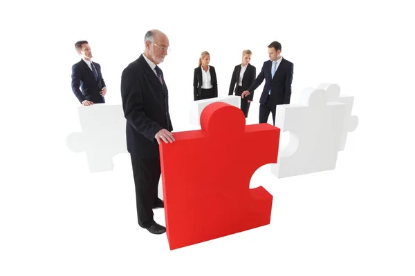 Business-Team und großes Puzzle — Stockfoto
