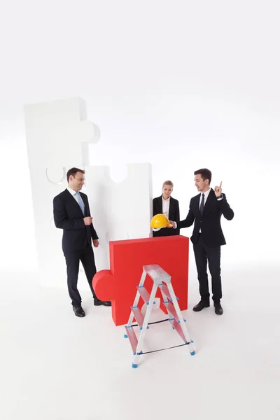 Business team e grande puzzle — Foto Stock