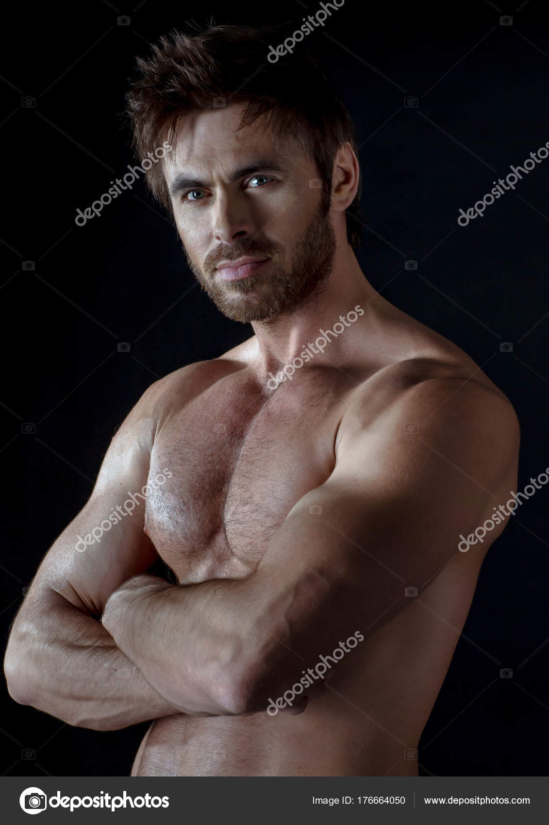Muscular man cross hands Stock Photo by ©ALotOfPeople 176664050