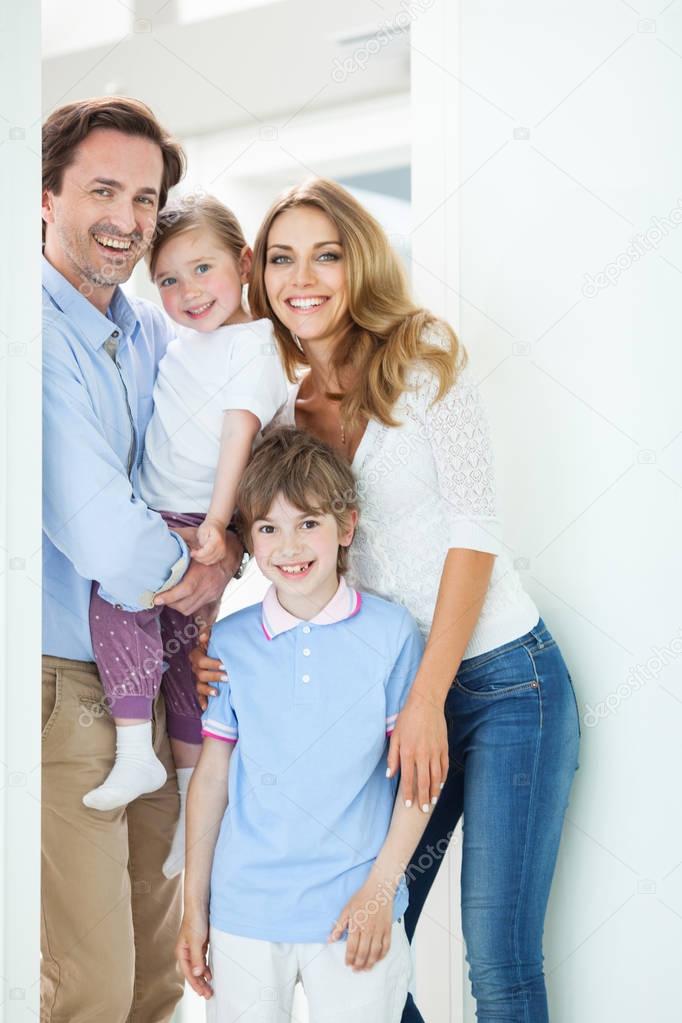 Happy family in doorway