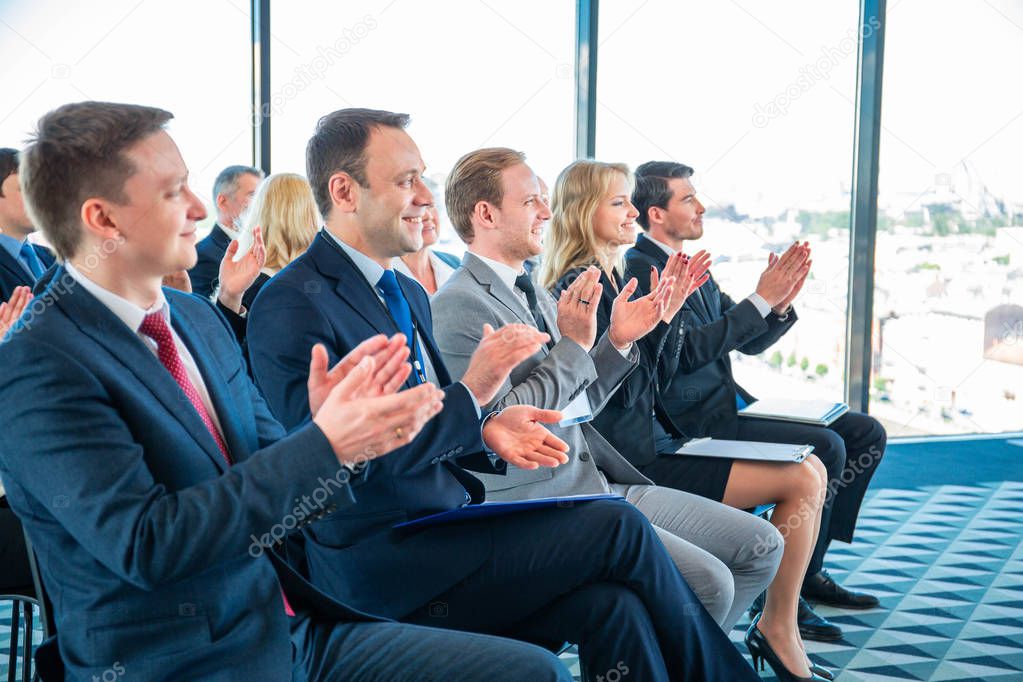 Applauding to speaker