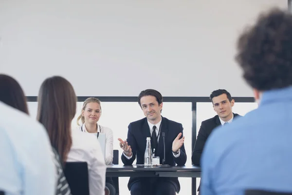 Speakers at business meeting — Stock Photo, Image