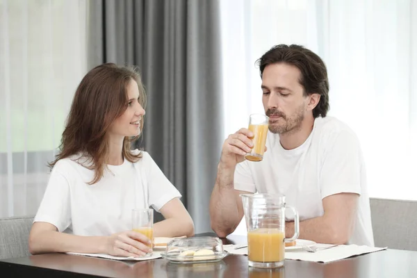 Happy Attractive Mid Adult Couple Eats Breakfast Together Home Orange — Stock Photo, Image