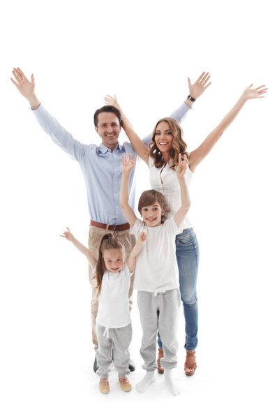 Happy family raised arms up four people, parents with with two children isolated on white background