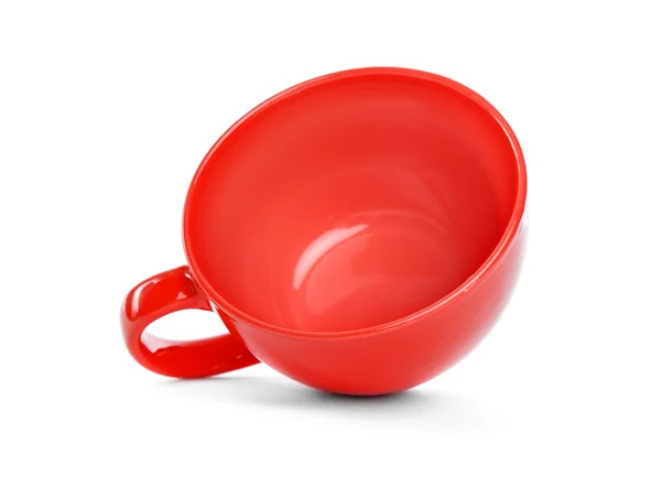 Cup lies on a white background. — Stock Photo, Image