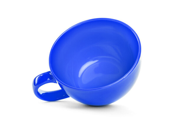 Cup lies on a white background.