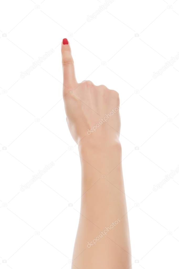 Woman hand pointing up with index finger