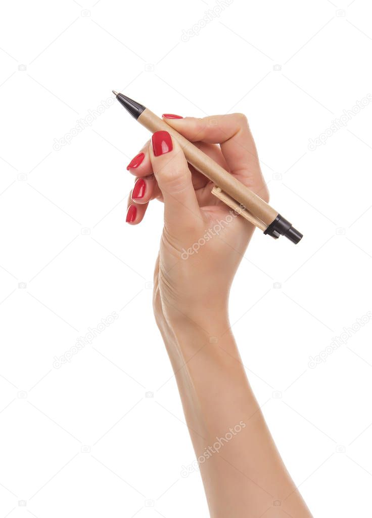 Womans hand with a pen.
