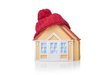 Evin bir eşarp sarılır.