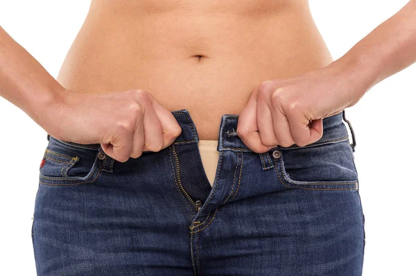 El exceso de peso. No puedes cerrar tus jeans. . — Foto de Stock