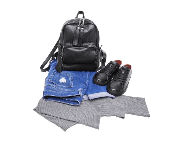 Sneakers ryggsäck jeans och en ljus tröja. — Stockfoto
