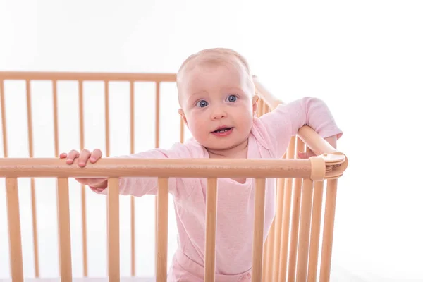 Baby girl at childrens playpen. — Stock Photo, Image