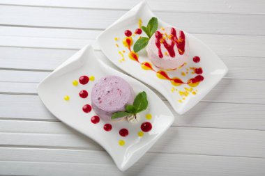 Tasty cake on white plate close up shot