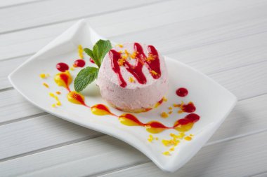 Tasty cake on white plate close up shot