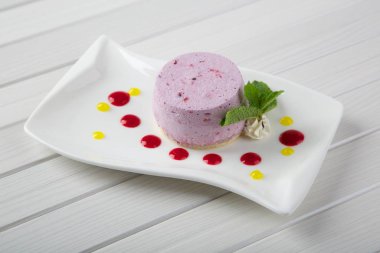 Tasty cake on white plate close up shot